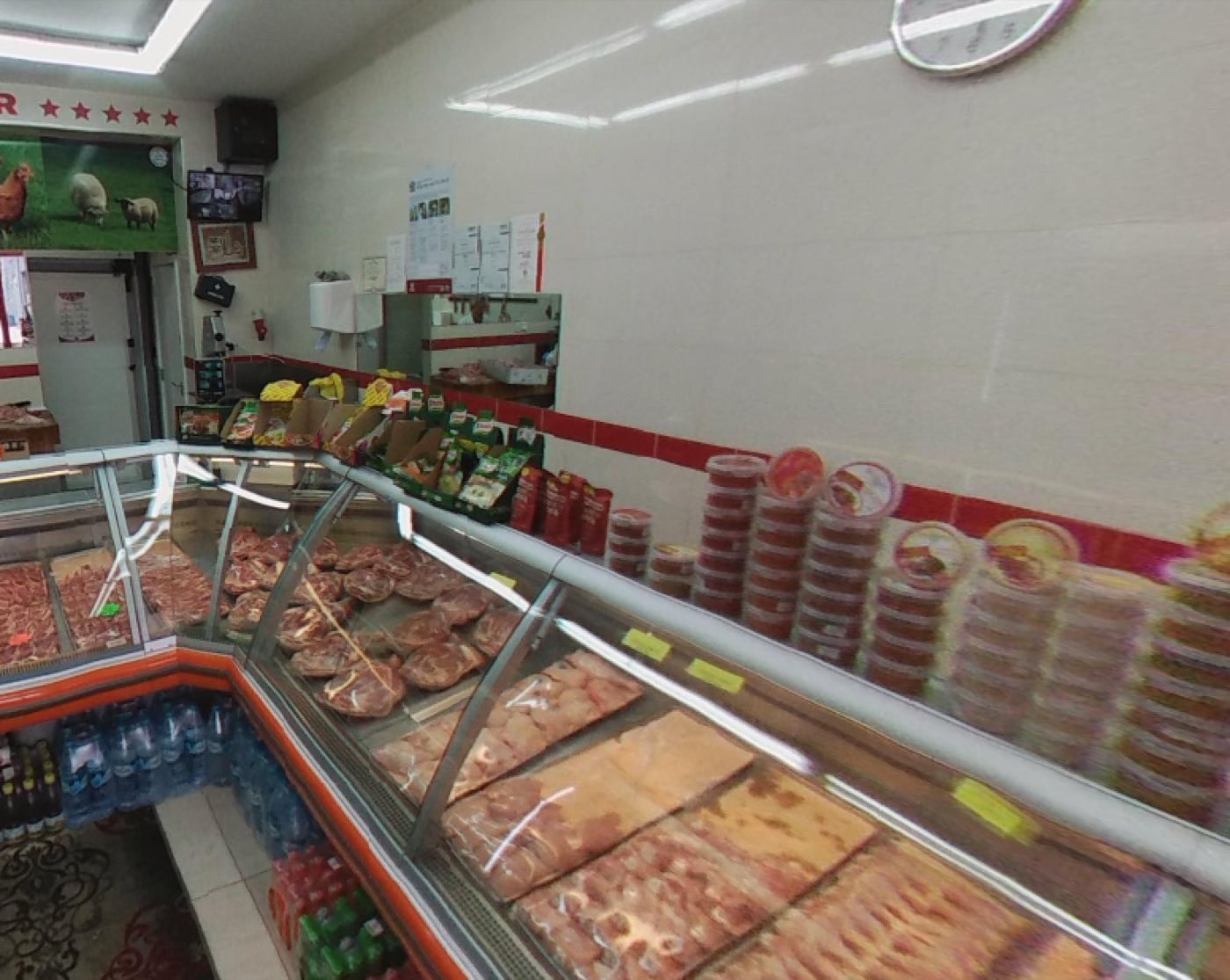 The chilled display case at Super Butcher, filled with fresh red-meat cuts, chops and marinated strips.
